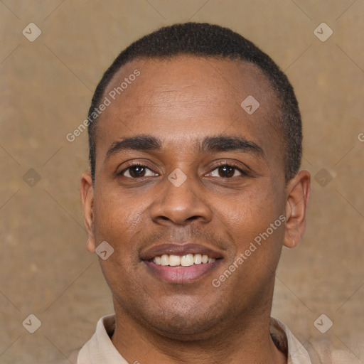 Joyful latino young-adult male with short  brown hair and brown eyes