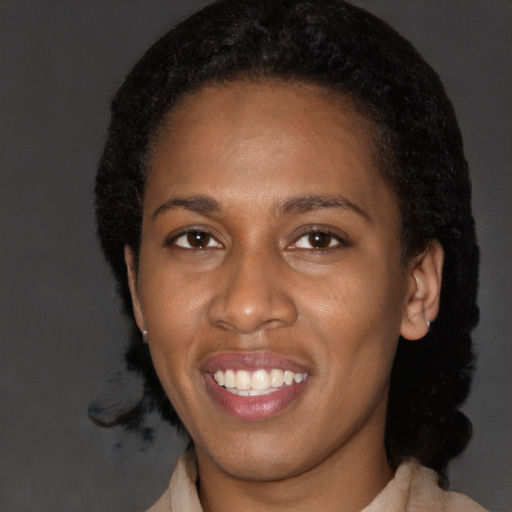 Joyful latino young-adult female with short  black hair and brown eyes