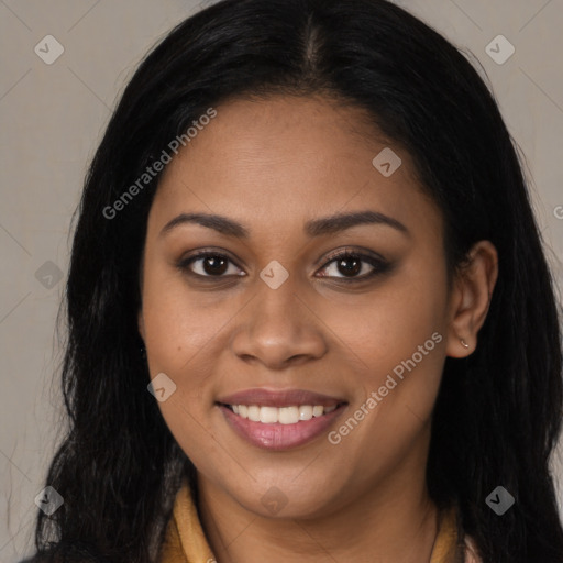 Joyful black young-adult female with long  brown hair and brown eyes