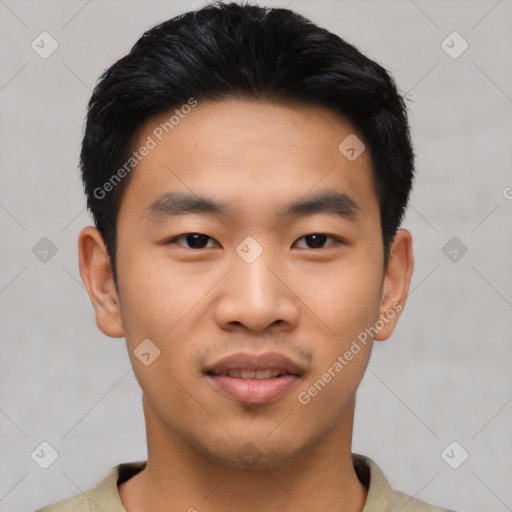 Joyful asian young-adult male with short  black hair and brown eyes