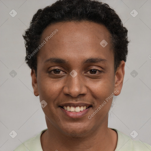 Joyful black young-adult male with short  black hair and brown eyes