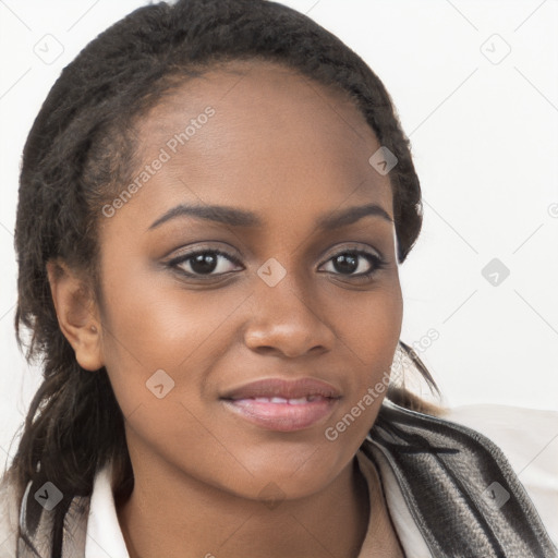 Joyful black young-adult female with long  brown hair and brown eyes