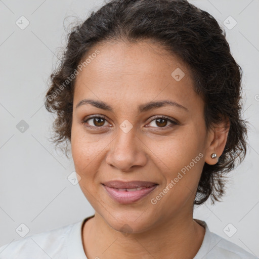 Joyful latino young-adult female with short  brown hair and brown eyes