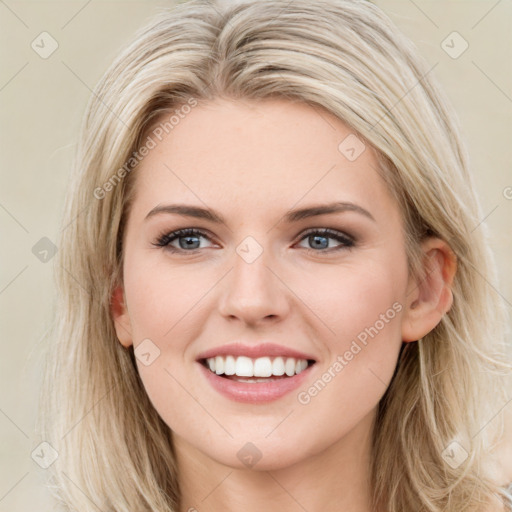 Joyful white young-adult female with long  brown hair and blue eyes