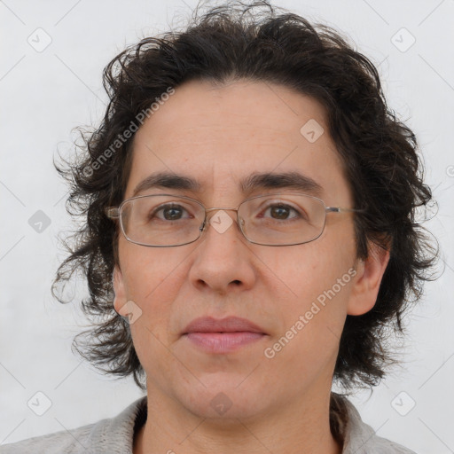 Joyful white adult male with medium  brown hair and brown eyes