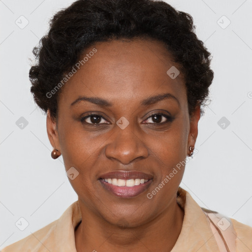 Joyful black adult female with short  brown hair and brown eyes