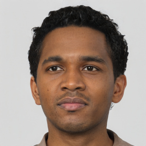 Neutral black young-adult male with short  black hair and brown eyes