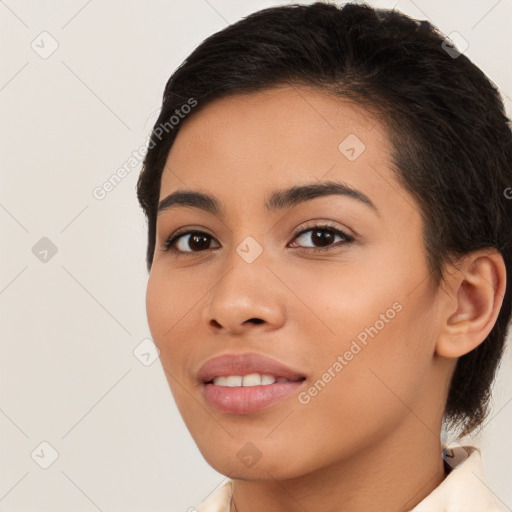 Joyful latino young-adult female with short  brown hair and brown eyes