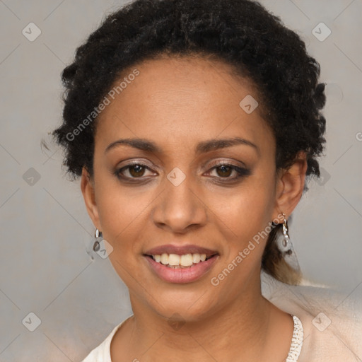 Joyful black young-adult female with short  black hair and brown eyes