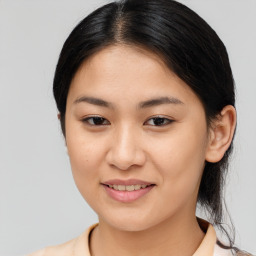 Joyful asian young-adult female with medium  brown hair and brown eyes