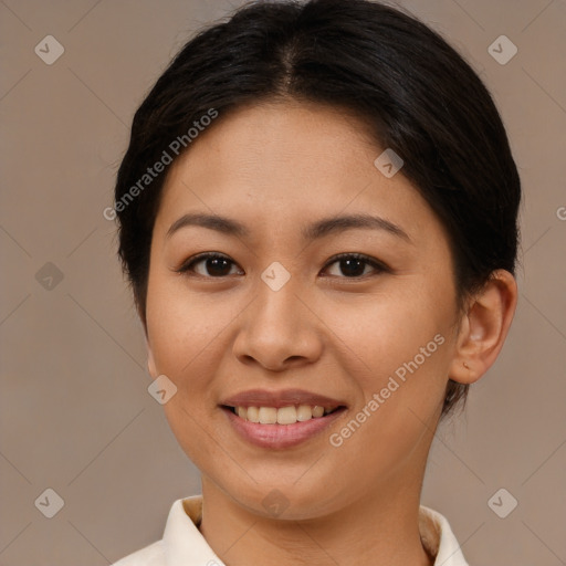 Joyful asian young-adult female with short  brown hair and brown eyes