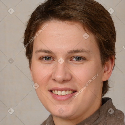 Joyful white young-adult female with short  brown hair and brown eyes