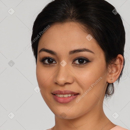 Joyful latino young-adult female with medium  brown hair and brown eyes