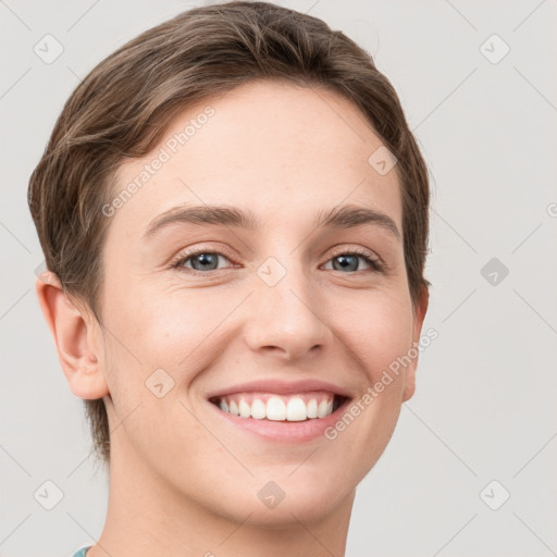 Joyful white young-adult female with short  brown hair and grey eyes