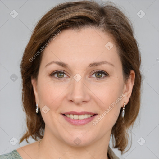 Joyful white young-adult female with medium  brown hair and green eyes