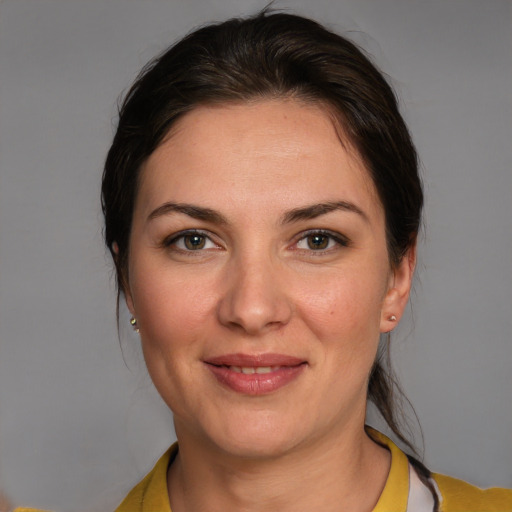 Joyful white young-adult female with medium  brown hair and brown eyes