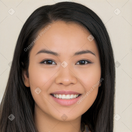 Joyful latino young-adult female with long  brown hair and brown eyes