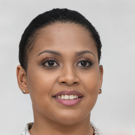Joyful latino young-adult female with short  brown hair and brown eyes
