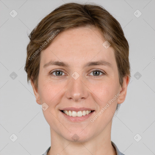 Joyful white young-adult female with short  brown hair and grey eyes