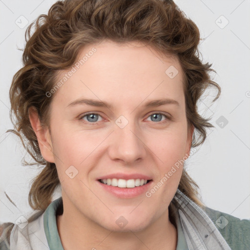 Joyful white young-adult female with medium  brown hair and blue eyes