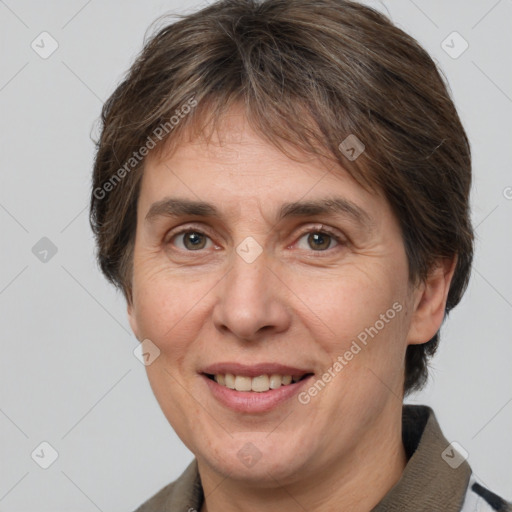 Joyful white adult female with short  brown hair and brown eyes