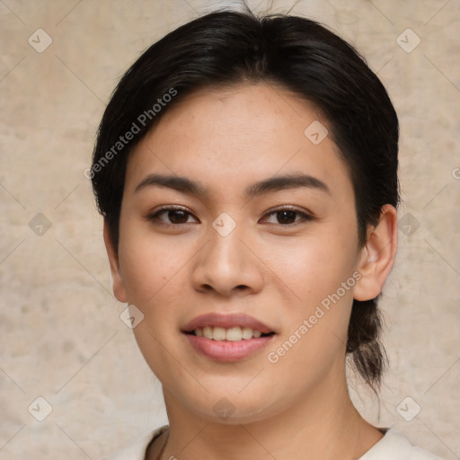 Joyful asian young-adult female with medium  black hair and brown eyes