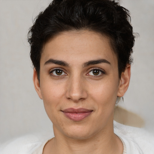 Joyful white young-adult female with short  brown hair and brown eyes