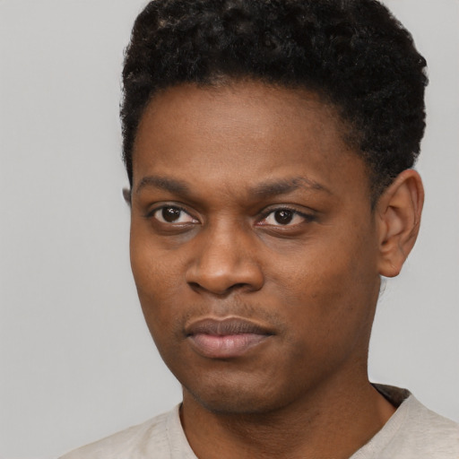 Neutral black young-adult male with short  black hair and brown eyes