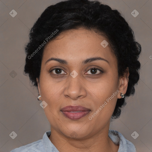 Joyful latino adult female with short  brown hair and brown eyes
