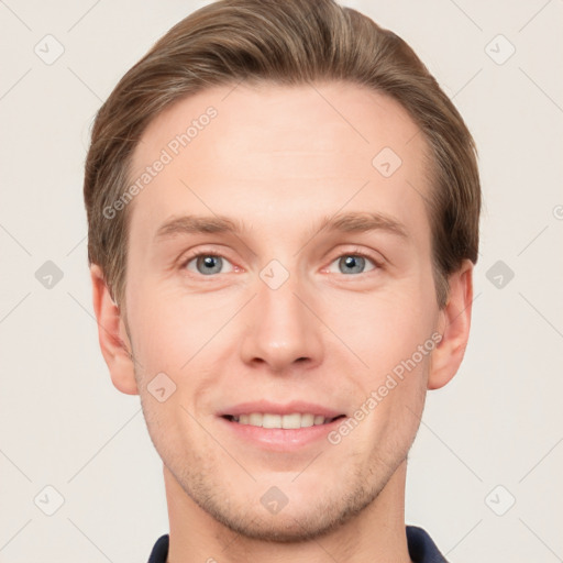 Joyful white young-adult male with short  brown hair and grey eyes