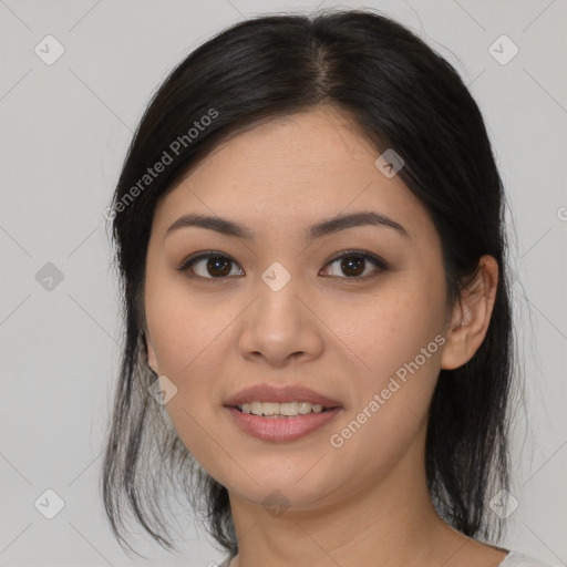 Joyful asian young-adult female with medium  black hair and brown eyes