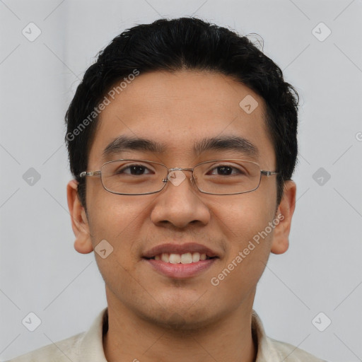 Joyful asian young-adult male with short  brown hair and brown eyes