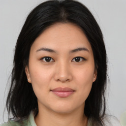 Joyful asian young-adult female with medium  brown hair and brown eyes