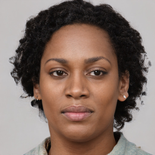 Neutral black adult female with medium  black hair and brown eyes