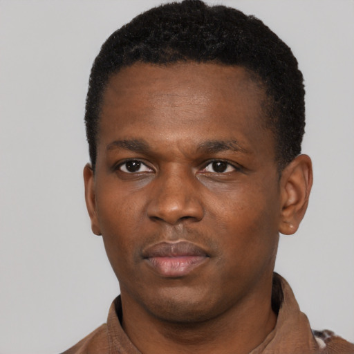 Neutral black young-adult male with short  black hair and brown eyes