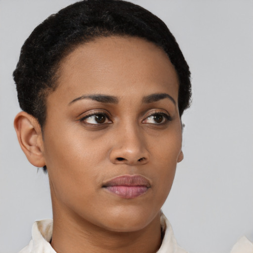 Neutral black young-adult female with short  brown hair and brown eyes
