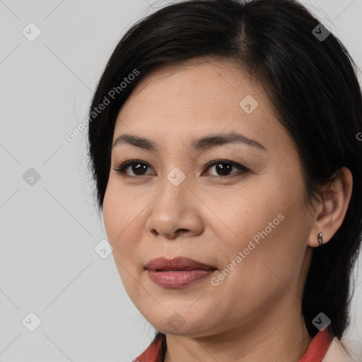 Joyful asian young-adult female with medium  brown hair and brown eyes