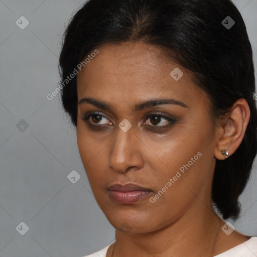 Neutral black young-adult female with medium  brown hair and brown eyes