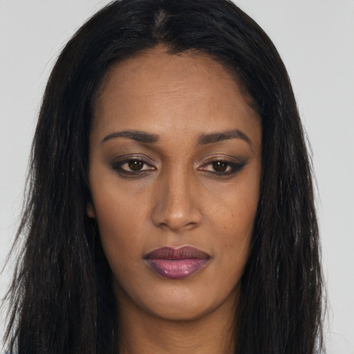 Joyful asian young-adult female with long  brown hair and brown eyes