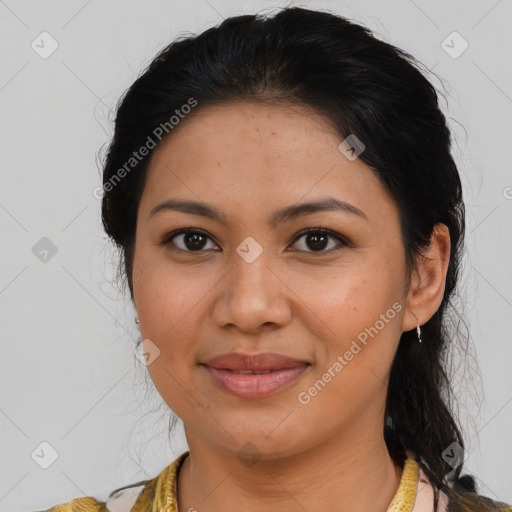 Joyful latino young-adult female with medium  brown hair and brown eyes