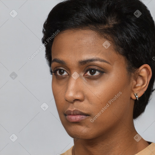 Neutral black young-adult female with short  black hair and brown eyes