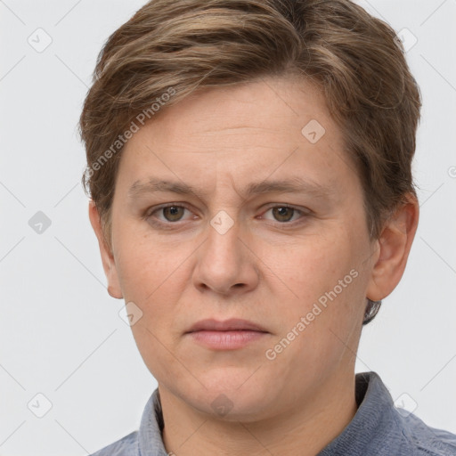 Joyful white adult female with short  brown hair and grey eyes