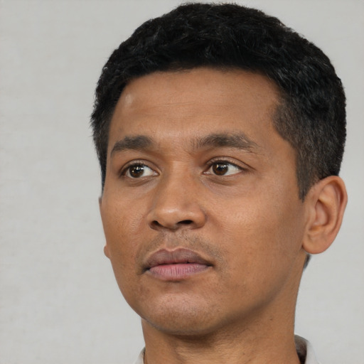 Neutral black young-adult male with short  black hair and brown eyes