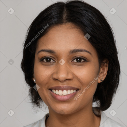 Joyful black young-adult female with medium  black hair and brown eyes