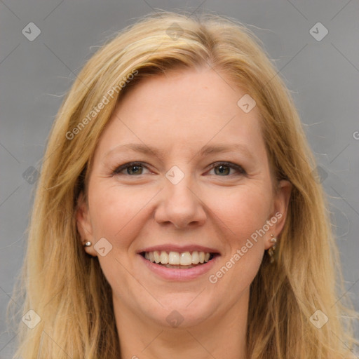 Joyful white adult female with long  brown hair and brown eyes