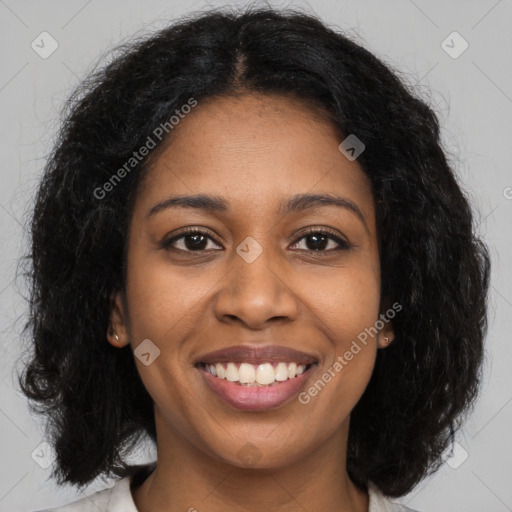 Joyful black young-adult female with long  brown hair and brown eyes