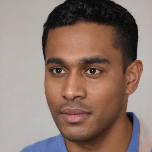 Neutral latino young-adult male with short  black hair and brown eyes