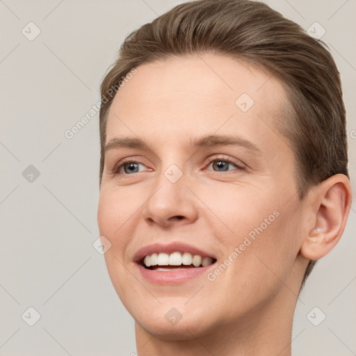 Joyful white young-adult female with short  brown hair and grey eyes