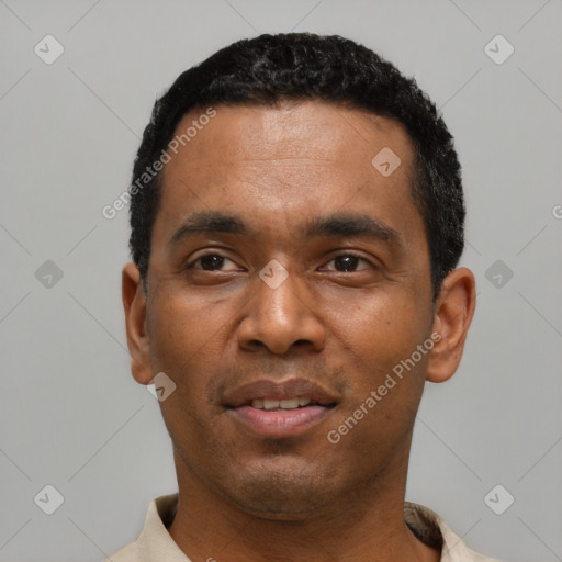 Joyful latino young-adult male with short  black hair and brown eyes