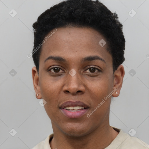 Joyful black young-adult female with short  black hair and brown eyes